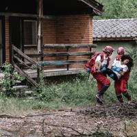 Rescue workers aiding disaster victim